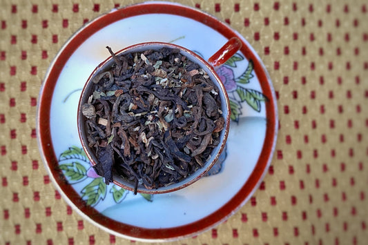 Aged tea and herbs in a teacup