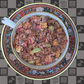 A teacup full of blended herbal tea on a Cocoa Legato logo background