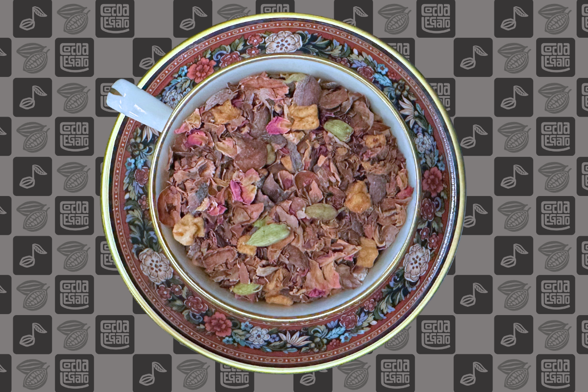 A teacup full of blended herbal tea on a Cocoa Legato logo background