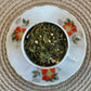 teacup full of green tea with ginger