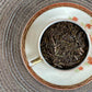 tacup full of brown twiggy leaf