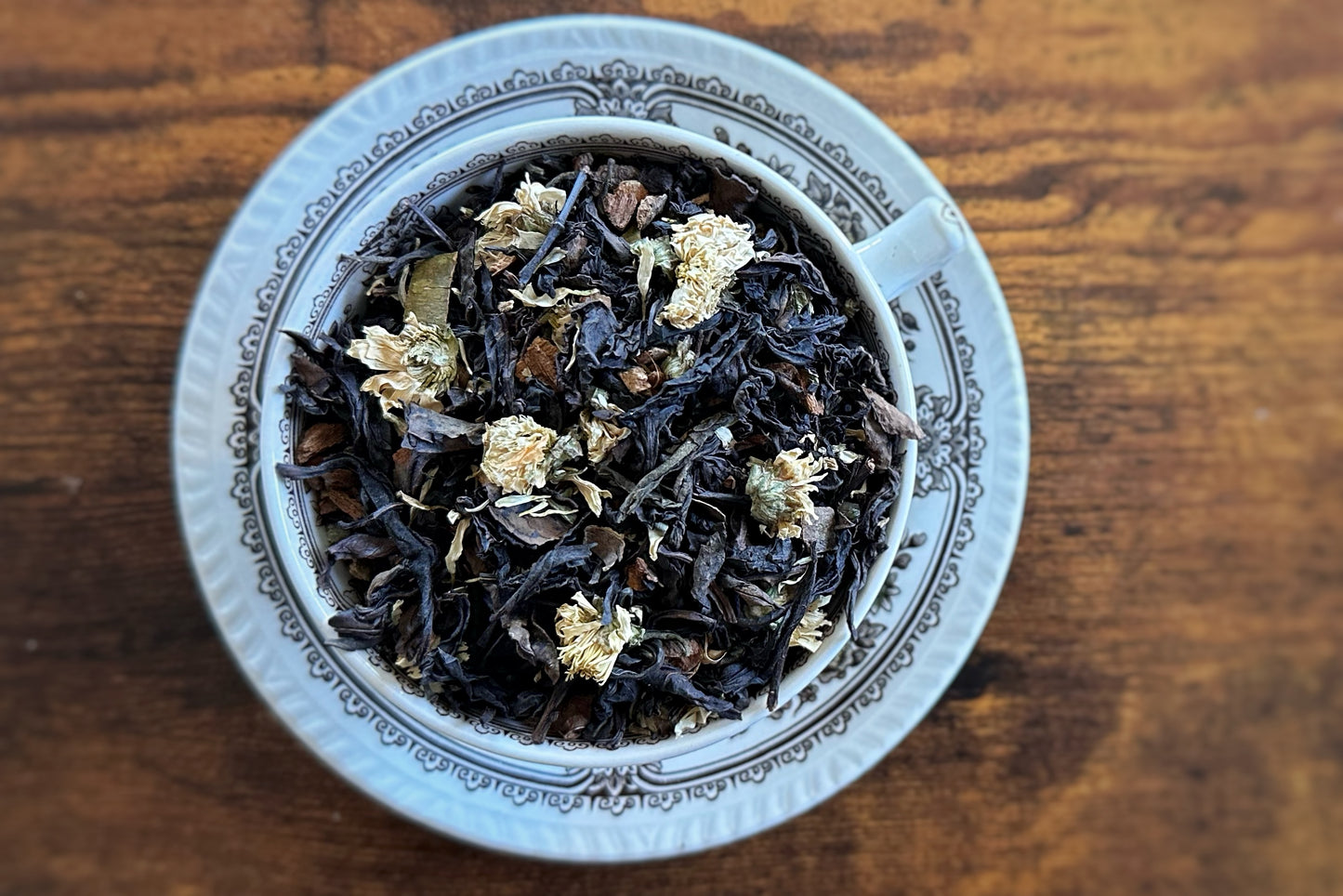 Teacup full of loose leaf tea and flowers