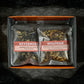 Open orange sampler box on black background with two teas showing: Nevermore & Wolfman