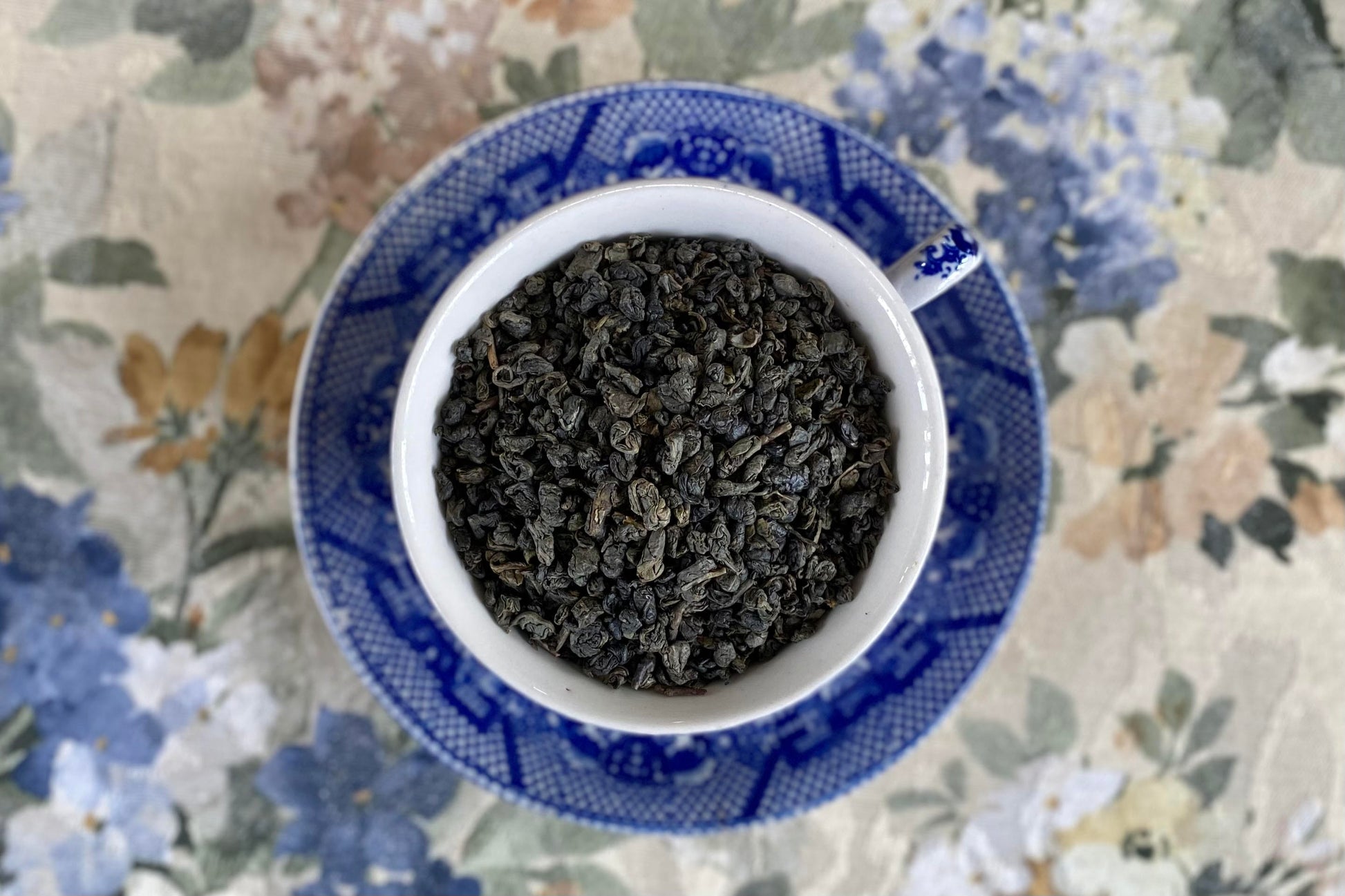 teacup full of rolled green tea pellets