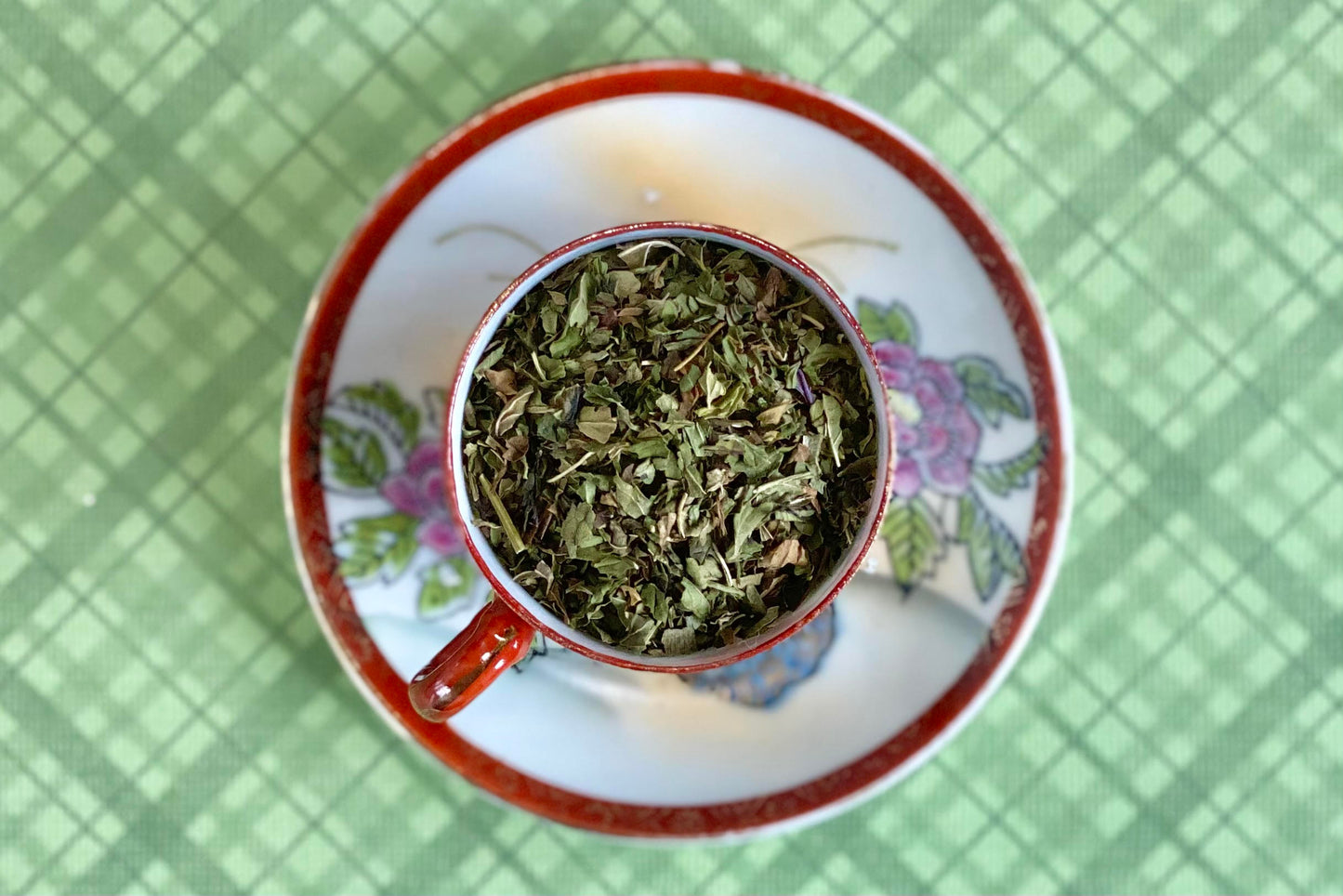 Teacup full of cut mint leaf