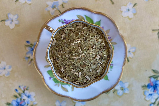 teacup full of cut green leaf