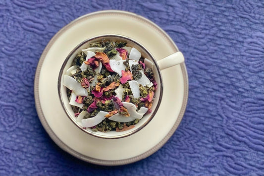 teacup full of rolled oolong tea, rose petal and coconut